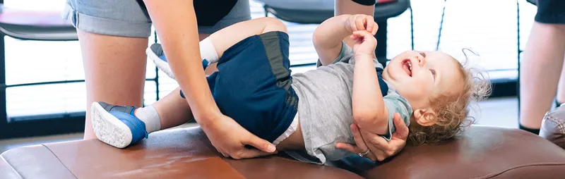 Pediatric Chiropractor Roswell GA Steven Lako Adjusting A Baby Patient